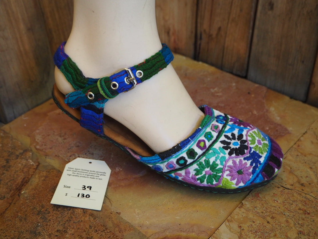 purple, green, blue flowers on white