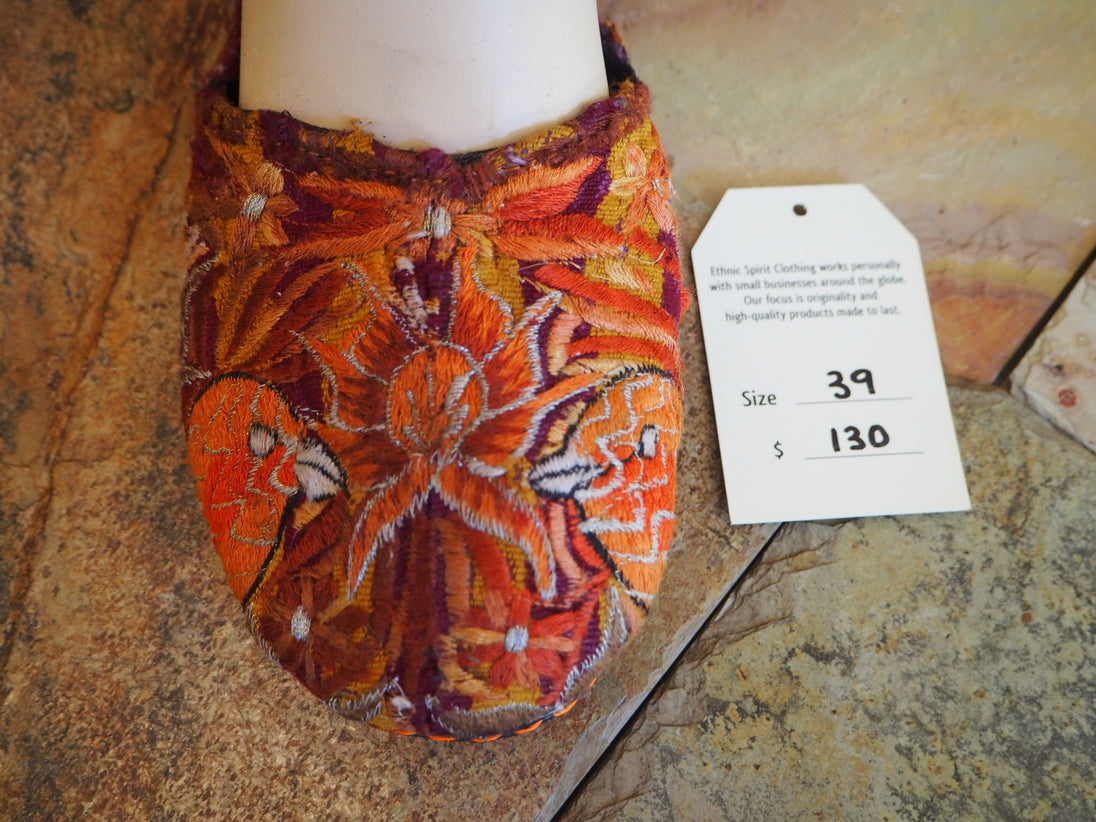 orange and silver birds and flower